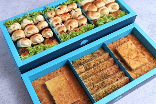 Mix Sukkar + Fatayer - Mix Sukkar  A box of our special products consisting of three flavors mixed with oriental cheese and&nbsp;biscuits,&nbsp;pistachio nuts, dates, and salted caramel.78pcs/.920g
&nbsp;Mini FatayerA box of 36 small pieces of delicious pies with a selection of carefully selected flavors’Carrot cheese, cheese olives mix, Pizza