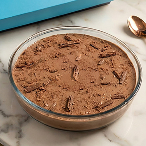 Big Flake - A rich, indulgent dessert featuring layers of creamy Flake mousse and fudgy chocolate brownie cake, generously topped with delicate Flake chocolate slices, served beautifully in a clear ceramic bowl.