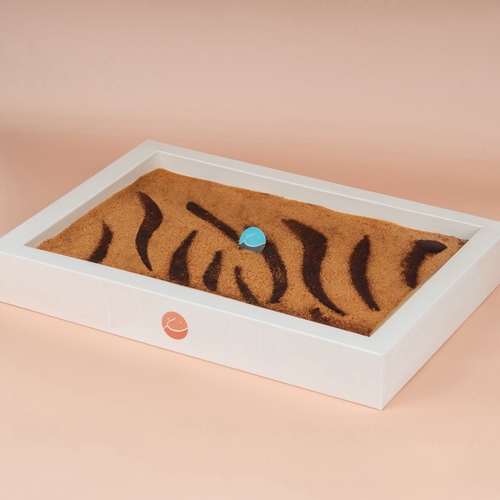 Tiger - A group of delicious espresso biscuit  layers mixed with layers of special sukkar cream carefully prepared and distributed, and covered with a layer of cocoa powder