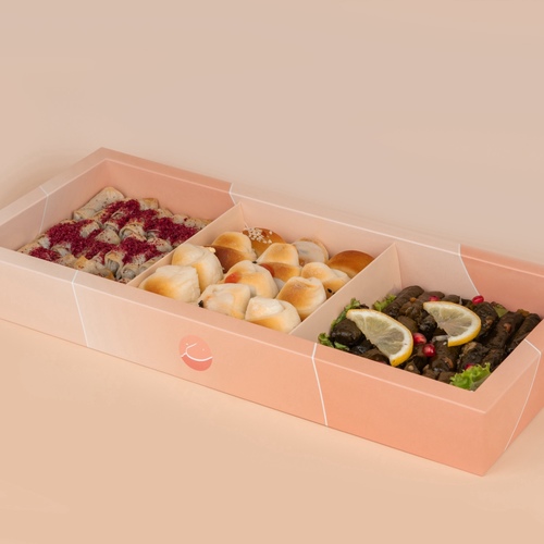 Mawajib Salty - A box of mixed Mawajib salty
containing 65 grape leaves with pomegranate molasses, chicken Mosakhan rolls with sumac, and a delicious assortment of
pastries.