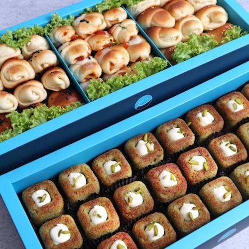 Basbousa + Fatayer - Basbousa 
24&nbsp;Pieces of delicious mini basbousa covered with basbousa sauce and pistachios with a special touch of sukkarFatayerA box of 36 small pieces of delicious pies with a selection of carefully selected flavors’Carrot cheese, cheese olives mix, Pizza