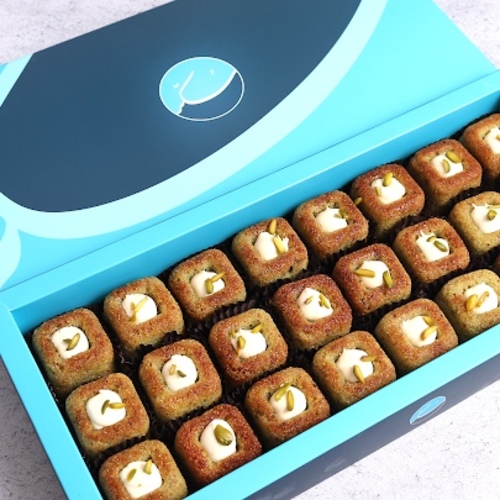 Basbousa Big - 24&nbsp;Pieces of delicious mini basbousa covered with
basbousa sauce and pistachios with a special touch of sukkar