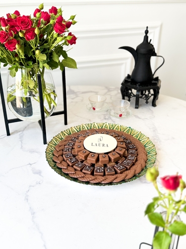 Green peacock chocolate tray C-007 - Belgian chocolate tray,  with phrase   Peanut butter, hazelnut crunch and barony fillings The number of beads is 73 800 gr Non returnable gift tray Delivery before Eid Mubarak