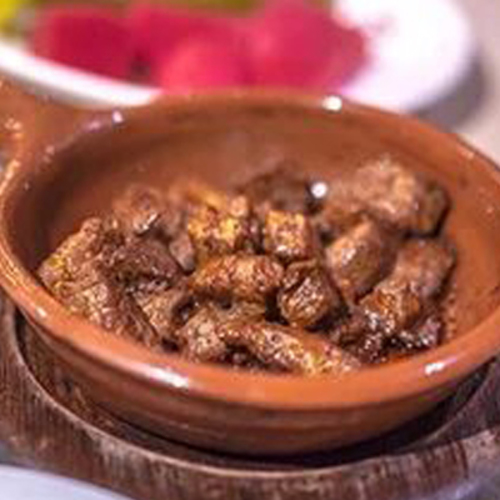 Ras Asfour - One of Mayar's Famous Dishes. The Luxurious Beef Fillet Dipped with Flavoring  Special Mayar Sauce. Prepared in Hot Pottery.