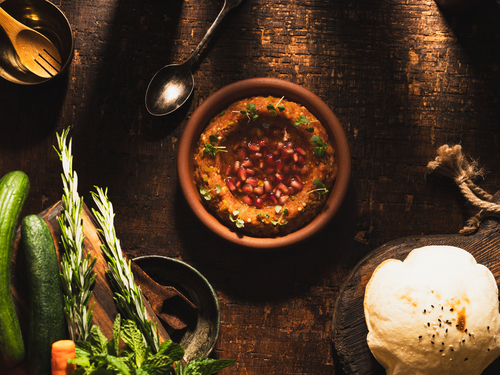 Baba Ghanouj - Eggplant Mixed with tomatoes,onion,parsley,mint, with leom juice & olive oil.