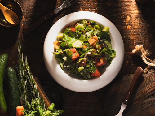 Fattoush - Fresh Mixture ofVegetables: Lettuce, Tomatoes, Watercress, Mint, Green Capsicumwith Zaatar, fried Bread With Home Apple Cider Vinegar, and Olive Oil And Lemon.