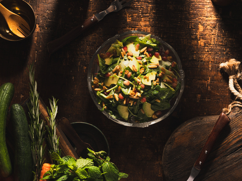 Maria Salad - Mixtures of Fresh leaves with Mayar Dressing topped with fresh sliced of Avocado & caramelized walnuts,pine seeds & pomegranate seeds.