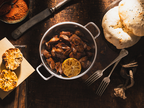 Chicken Liver with Pomegranate Sauce - Fresh Chicken Liver Fried with Butter and Spices and Pomegranate Sauce.