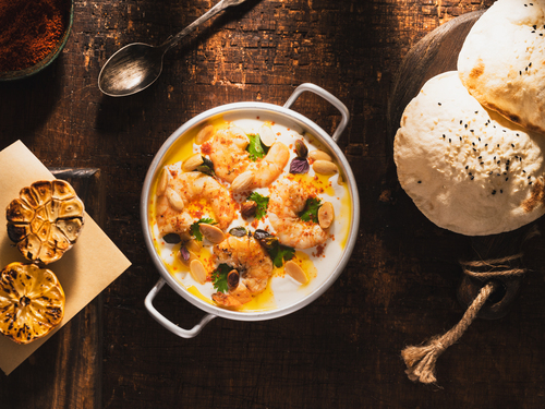 Mayar Restaurant - fatteh shrimp - grilled bread with chickpeas and yogurt topped with shrimps mixed arminian spices and nuts