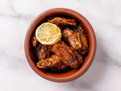 Mayar Restaurant - Chicken Wings with Pomegranate - Fresh Fried Chicken Wings with Coriander, Pomegranate Molasses, Luxurious Flavors, and Lemon.