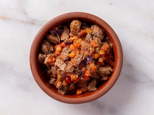 Ras Asfour with Armenian Tomatoes - Dice of Beef Fillet. Dipped with Flavoring and Armenian Tomato Sauce. Prepared In Hot Pottery.