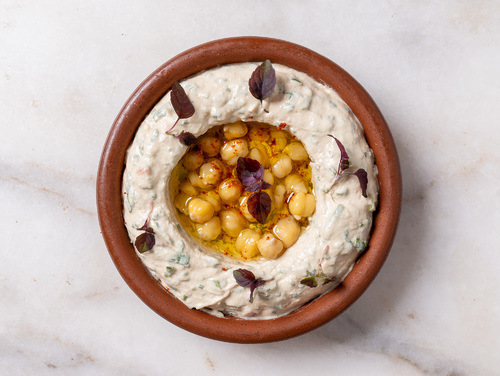 Hummus Beiruti - The Famous Hummus Beiruti with Vegetables, Tomatoes, Onions, Parsley, and Mint With Flavoring.