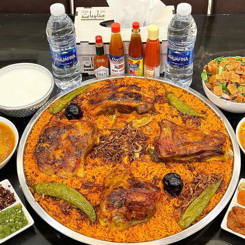 Trays of red Kabsa with Australian meat