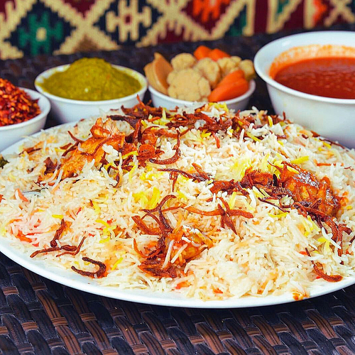 monasabat restaurant - Australian Meat Biryani - Basmati bread cooked in meat broth with ghee, cardamom, spices and saffron. It is served with cooled Australian meat with sauce, in addition to potato broth, agar and maabouj.