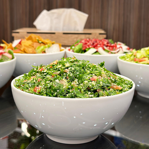 monasabat restaurant - Tabbouleh - Parsley - mint - tomato - onion - soft broccoli - lemon - pomegranate molasses - olive oil.