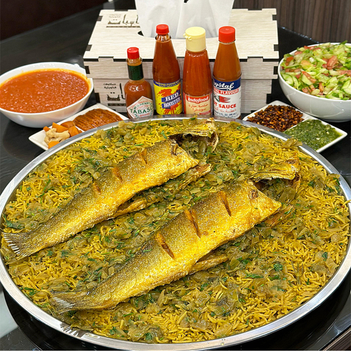 Sea Bass Mutabbaq - Two pieces of fresh seabass served with basmati rice, made for fish cooked with dill