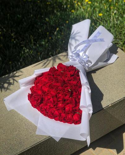 hand whity - hand bouquet contains red roses