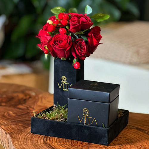 In love - Black tray contains red roses, baby roses with box of chocolate.  H : 15 W : 15