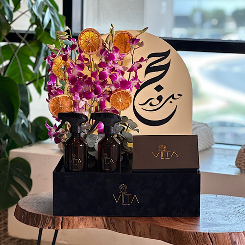 Moped - Black box contains purple baby orchid, drift fruit, 300 gram box of chocolate with 2 spray perfume. Height: 65 Width: 40