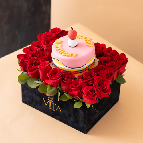 noi - black box contains red roses and green leaves with middle cake  Height: 25 Width: 20