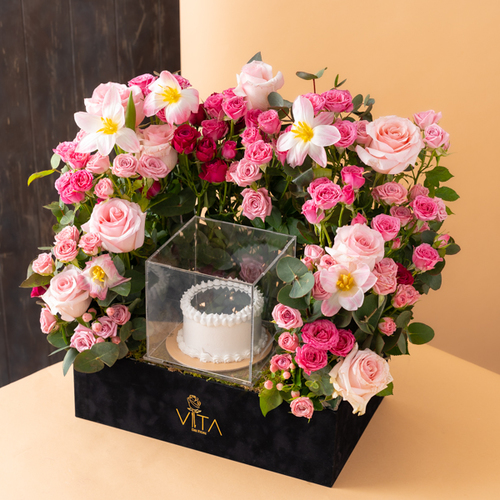 the superior - black box contains white roses, pink, white tulip  pink baby roses pink & baby roses fuchsia
green leaves  with mirror cake  
  H: 55 cm   W : 40