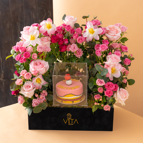 the sam - black box contains white roses, pink, white tulip pink baby roses pink & baby roses fuchsia, green leaves and with cake 
 H: 55
W: 40