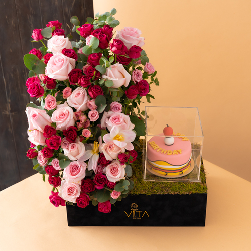 Vita Dei Fiori - happiness - This bouquet contains roses and baby roses with a cake. Height: 65 Width: 40