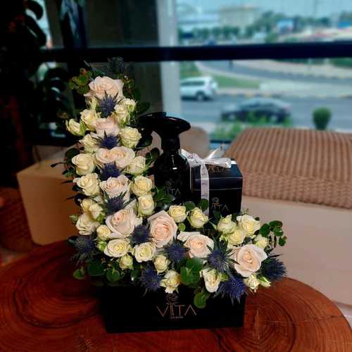 bazooka - Black  box contains White roses and baby  roses , Eryngium green leaves & box of chocolate and  spray perfume. Height: 40 Width: 20