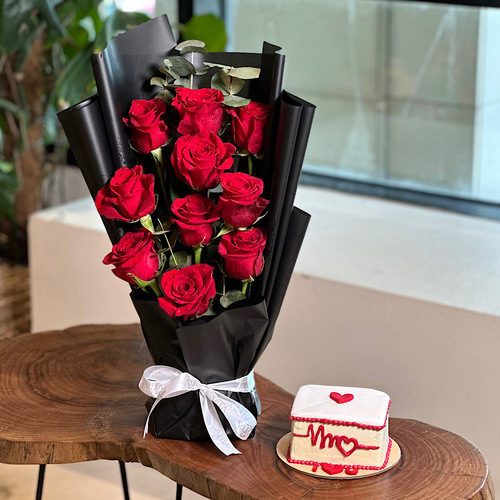 Hanjala - Hand bouquet that contains red roses with black wrapping and a love day cake. Height: 45 Width: 20