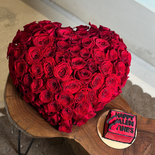 Loving Fantasy - Red roses in a heart shape design with valentine's cake. Height: 12 Width: 35