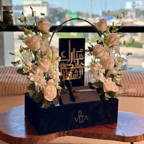 RITA - Black box contains white roses green leaves white baby orchid with chocolate and Ramadan stand Height: 50 Width: 20