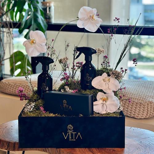 Aromatic - A black box that contains white orchid, steel grass, wax flower, raish flower, and flat mouse green with chocolates and 2 spray perfume. Height: 50 Width: 40