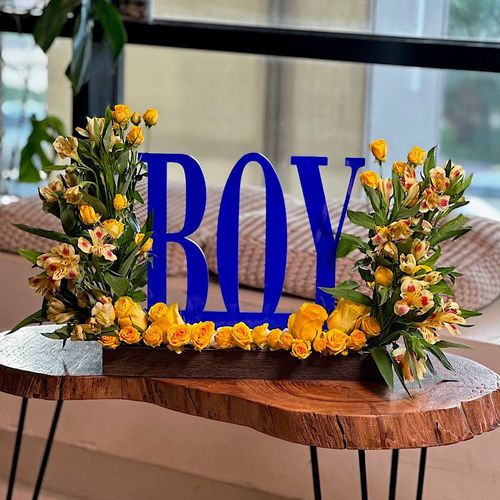 Ocean - A wooden tray contains baby roses yellow  astomeriya yellow , an acrylic stand for a boy new born. Height: 50 Width: 35