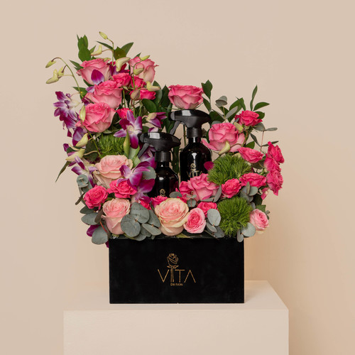 Aromes - A black box contains purple baby orchid, green leaves, pink roses, and baby roses with 2 spray purfume. 
 H 55 cm  W 25 Cm