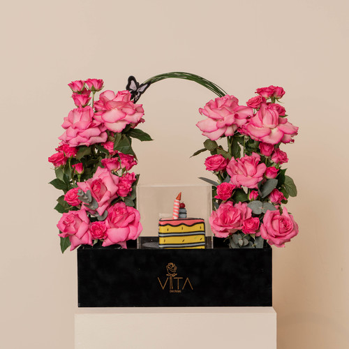 olivero - black box contains pink roses fucia baby roses green leaves with cake 
 H: 65 W: 40