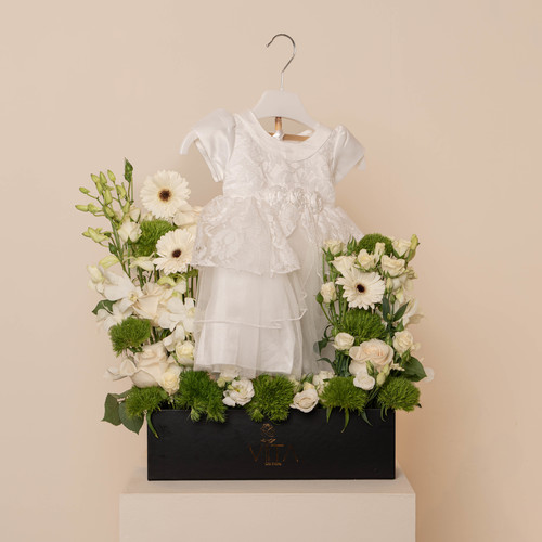 info - black box contains white Garbera green leaves white baby roses with new dress  H: 70 
 W: 35