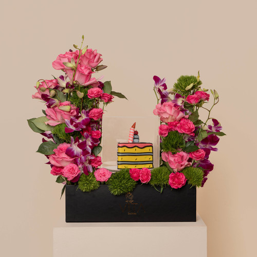 the  in - back box contain purple orchid pink roses fuica baby roses green leaves with middle cake 
 H 65 cm  W : 40 cm