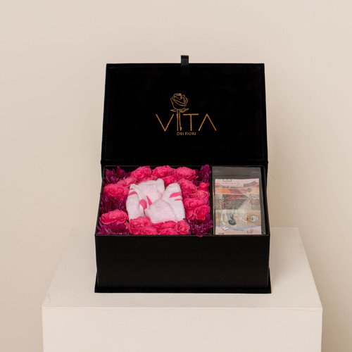 The baby girl box - Black velvet box contains purple crys, fucia baby roses with middle pink new born shoes and place to add money Height: 15Width: 20