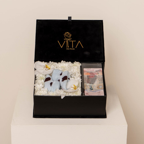 The baby boy box - Black velvet bix contains white crys, white cut orchid with middle blue new born shoes and place to add money Height: 15Width: 20