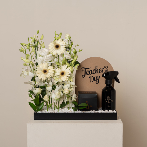 froi - black stand contains white grabera , white orchid , spray perfume box of chocolate and teachers day stand Height: 55  Width: 35