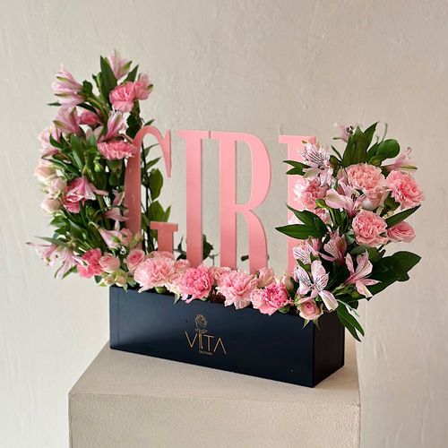 gryzli - A black box contains baby roses pink carnations, pink astomeriya, an acrylic stand for a girl new born. Height: 50 Width: 35