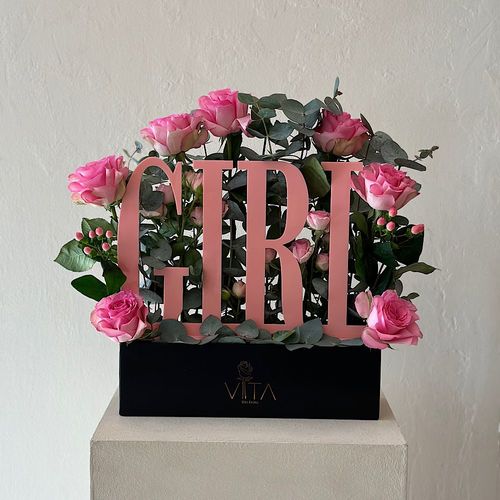 Reg - A black box contains baby roses, roses, and green leaves. 
 H 35  W 30