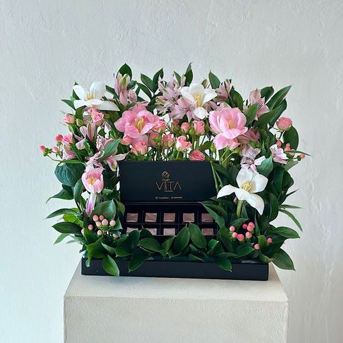 arman - A black try  that contains pink, white tulip, hypericum pink baby roses pink astomeriya pink ruscus leaves and box of chocolates. Height: 35 Width: 30