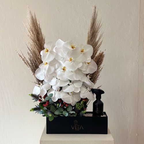 sense - A black box  contains white orchid flowers and artificial feathers with home fragrance. 
 H 70  w 30