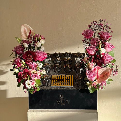 Serenity - Black box contains pink roses, estoma, waxflower, cymbidium, anthurium, and green leaves, with tea set 18 pcs  Height: 55  Width: 40