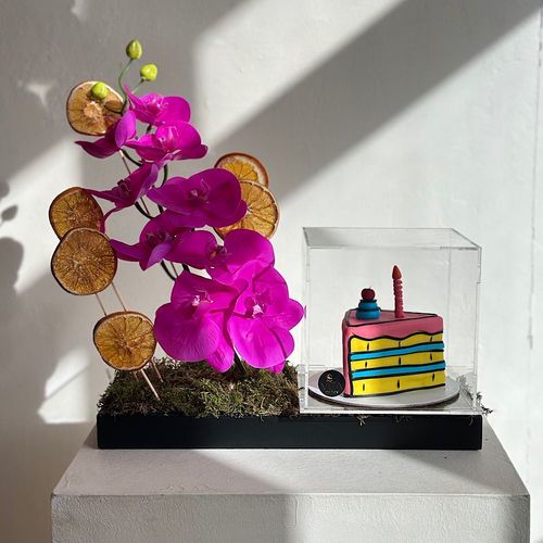 Buzau - A tray elegantly filled with orchids and dried fruits with and with a cake Height: 50 Width: 20