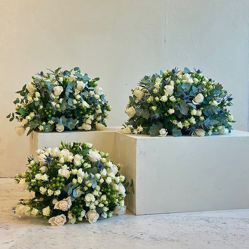PEARL - A 3 trays contains elegantly white roses and white baby roses and green leaves roses, Hypericum green, Eryngium, green leaves... Height: 40 Width: 20