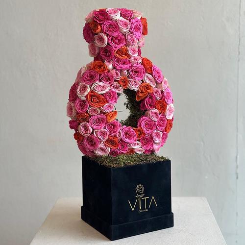 Khatam - A black box contains ring-shaped flowers fuchsia, orange and pink baby roses. Height: 55 Width: 18