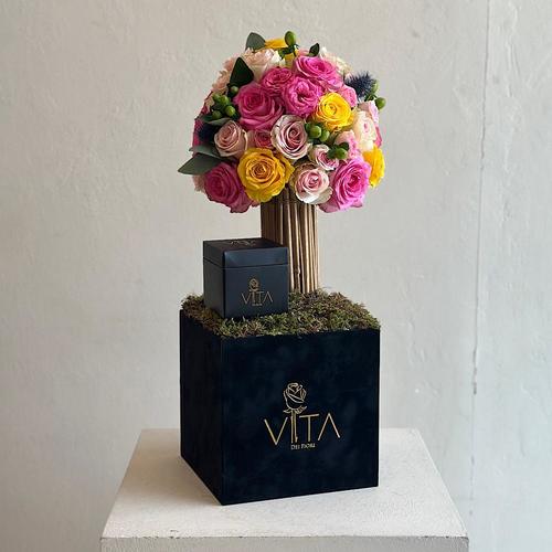 Valley - A black box contains with roses in pink, yellow, rose and sweet unique, hypericum green eryngium, green leaves and box of chocolate Height: 70 Width: 20