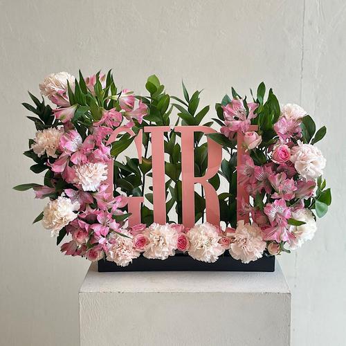 Eirlys - A tray elegantly filled with  baby roses pink carnations pink astomeriya pink,  ruscus green acrylic stand girl new born Height: 45 Width: 30